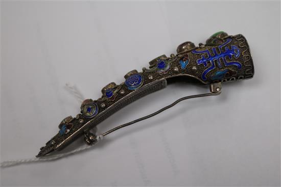 A late 19th/early 20th century Chinese silver filligree, enamel and gem set nail guard, 86mm.